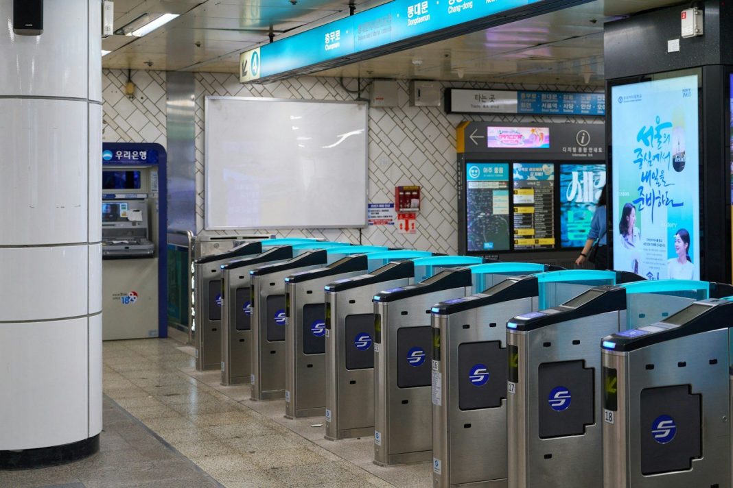 Automated turnstiles in a subway station entrance.