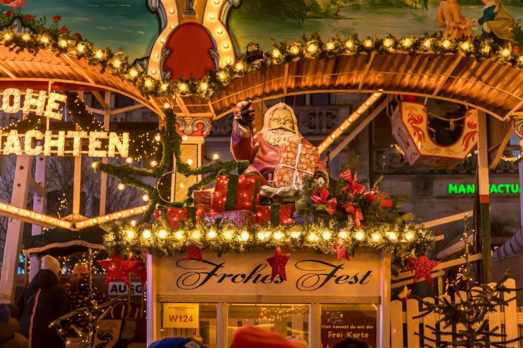 A christmas display with a santa clause on top of it