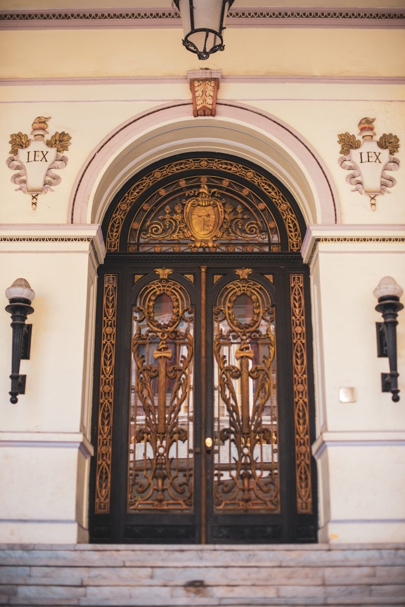 A building with a large metal door and a light