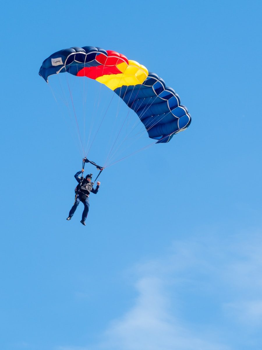 a man is parasailing in the blue sky