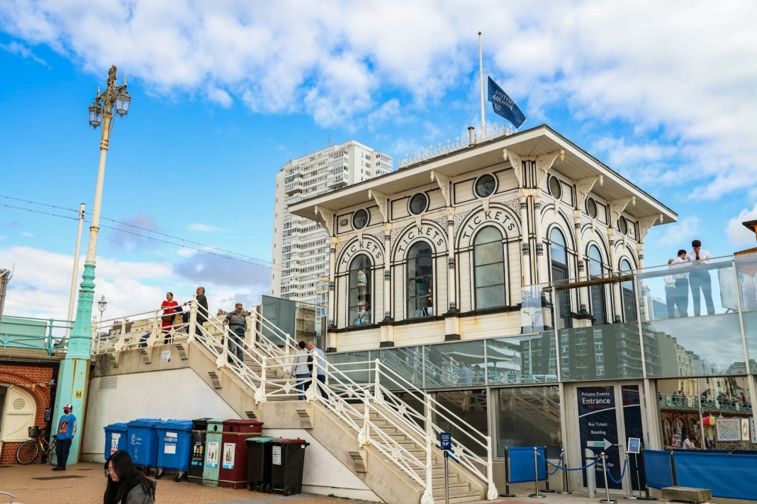a large white building with a flag on top of it