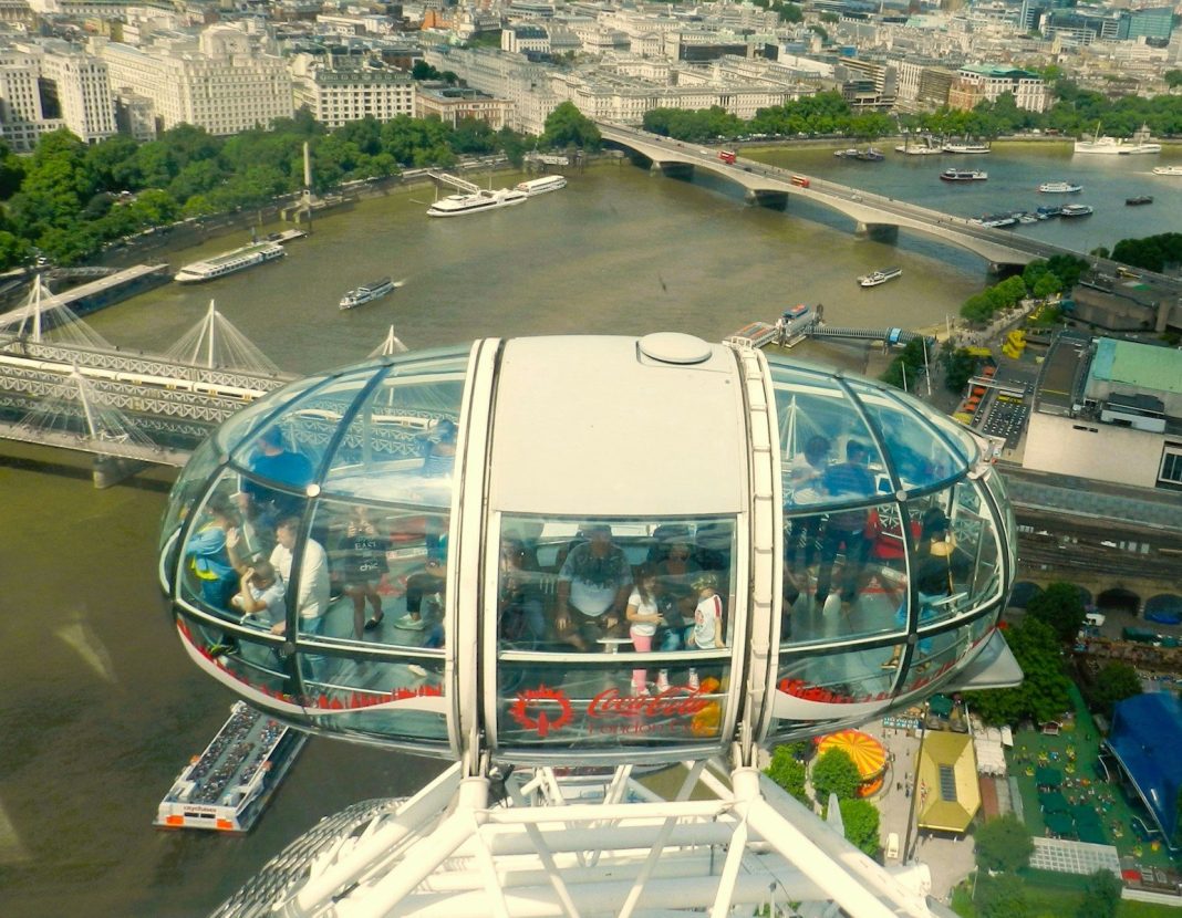 an aerial view of a ferris wheel in a city